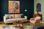 Woman's side-profile portrait in vivid orange and charcoal, exhaling smoke, mixed media contemporary canvas wall art