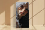 Hyper-realistic female portrait with split white and black hair, red lips, chain jewelry u2014 bold digital art canvas