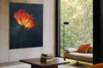 Glowing poppy bloom in deep orange-red and amber-yellow against dark teal, dramatic floral portrait canvas wall art