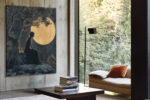 Seated female silhouette beneath a full moon and gnarled tree in deep navy and warm gold, romantic wall art canvas