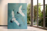 Two red-crowned cranes in mid-flight, muted teal acrylic, japandi wall art canvas for living room or bedroom