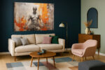 Seated male figure in charcoal and vivid orange, mixed-media portrait canvas wall art for contemporary living room