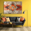 Concentric diamond motif on cracked plaster in burnt orange and charcoal, bold abstract mixed-media wall art canvas