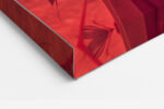 Profile figure in geometric crimson garment with tropical leaf headdress and origami cranes, bold digital art canvas print
