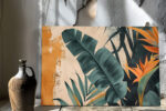 Banana leaves and bird of paradise bloom in dark teal and amber, botanical mixed-media wall art canvas for living room