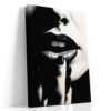 Extreme close-up of dark lips and fingers in monochrome chiaroscuro, bold portrait canvas for contemporary living room