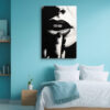 Extreme close-up of dark lips and fingers in monochrome chiaroscuro, bold portrait canvas for contemporary living room