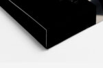 Extreme close-up of dark lips and fingers in monochrome chiaroscuro, bold portrait canvas for contemporary living room