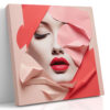 Female face emerging through coral pink geometric paper layers, bold red lips portrait mixed-media canvas for living room