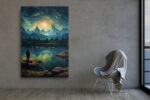 Lone figure on rocky lakeshore gazing at moonlit snow-capped mountains reflected in still water, night sky canvas wall art