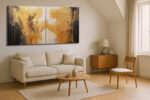 Two gold figurative forms reaching across a dark and light diptych, dramatic impasto canvas wall art for living room