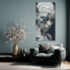Fractured porcelain humanoid face in slate blue and off-white, moody digital portrait canvas art for living room