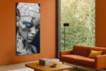 Fractured porcelain humanoid face in slate blue and off-white, moody digital portrait canvas art for living room