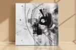 Bold black abstract silhouette with geometric arc lines and ink splatters, monochrome mixed-media canvas art for living room