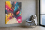 Abstract acrylic paint burst in vivid yellow, magenta, and cyan on dark navy, bold wall art canvas for living room