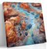 Aerial canyon waterway with vein-like rock patterns in burnt sienna and cerulean blue, digital art canvas for living room