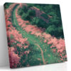 Aerial winding path through pink flowering bushes and dark green canopy, romantic illustration-style square canvas print