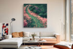 Aerial winding path through pink flowering bushes and dark green canopy, romantic illustration-style square canvas print