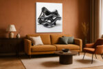 Glossy black abstract sculpture with looping voids on white background, bold minimalist wall art canvas for living room