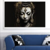 A golden Buddha figure sits in lotus meditation pose against a dark background
