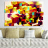 A geometric cube rendered in bold, segmented colors - reds, blues, yellows, and greens meet at sharp angles