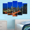 This five-panel canvas shows an illuminated city skyline at night