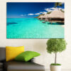 This canvas shows a coastal bay where turquoise water meets open sky, with island silhouettes visible on the horizon