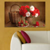 A wicker basket holds fresh flowers and ripe strawberries in warm natural tones