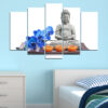 A seated Buddha figure surrounded by glowing candles and purple orchid blooms