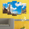 This five-panel canvas print shows a historic cathedral with twin spires rising beside a river at dusk