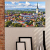 This canvas shows the rooftops of Tallinn's Old Town - terracotta tiles, stone spires, and weathered chimneys under a pale sky