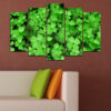 This five-piece canvas shows a cluster of four-leaf clovers with white blooms against a soft green background