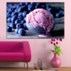 A close-up of blueberry ice cream with fresh berries in rich purple and cream tones