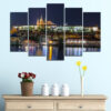 This five-piece canvas set captures a city street after dark, lit by glowing neon signs in electric blues, pinks