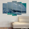 A dolphin glides through clear blue water across five connected panels