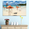 A pink flamingo stands in still water, surrounded by soft coral and aqua tones