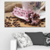 This canvas shows roasted coffee beans scattered across a neutral surface with soft floral accents