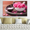 A close-up of a pink rose in soft focus, showing layered petals with cream and blush tones