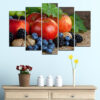 This five-piece canvas set displays an assortment of fresh fruits in vivid reds, greens, yellows, and oranges
