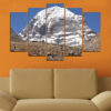 Five connected panels show a snow-covered mountain peak rising against a clear blue sky