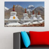 A snow-covered Tibetan mountain rises against a deep blue sky