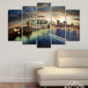 Five connected panels show an urban street scene at night with glowing lights