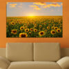A field of sunflowers in full bloom stretches across the canvas, their golden petals bright against green stems and leaves