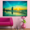 This seascape shows calm waters under a warm sunset sky with golden and amber tones blending into deep blue