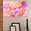 A close-up of manicured nails painted in glossy bubblegum pink