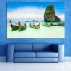 This canvas shows boats resting on turquoise water, their hulls mirrored in calm reflections