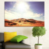 A desert landscape with rolling sand dunes beneath a bright sun
