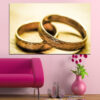 Two gold wedding rings interlock against a soft neutral background