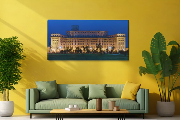 Hillside Castle Above River Town Canvas Print - on the wall in a room interior