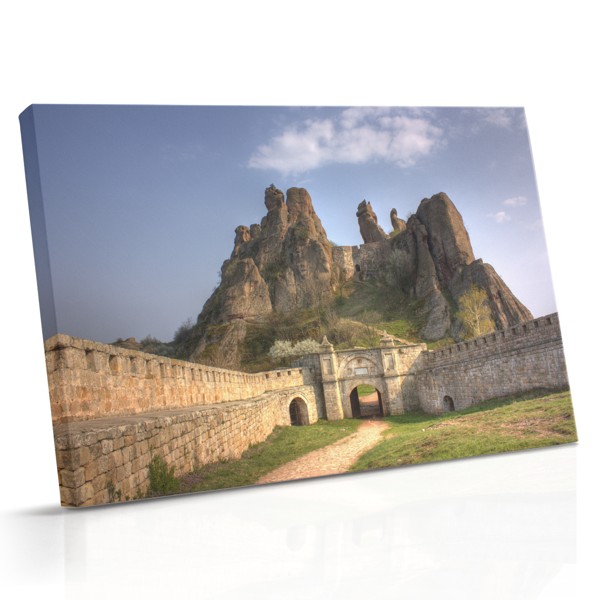 Vintage Bicycle Against Stone Wall Canvas Print